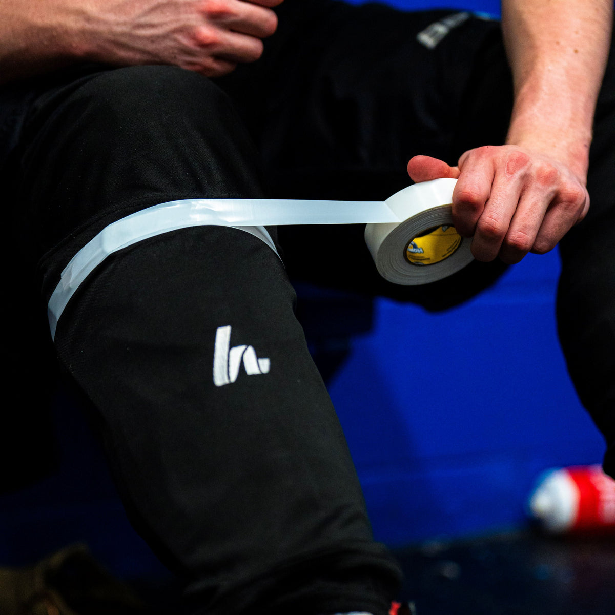 White Shin Pad Tape on black socks