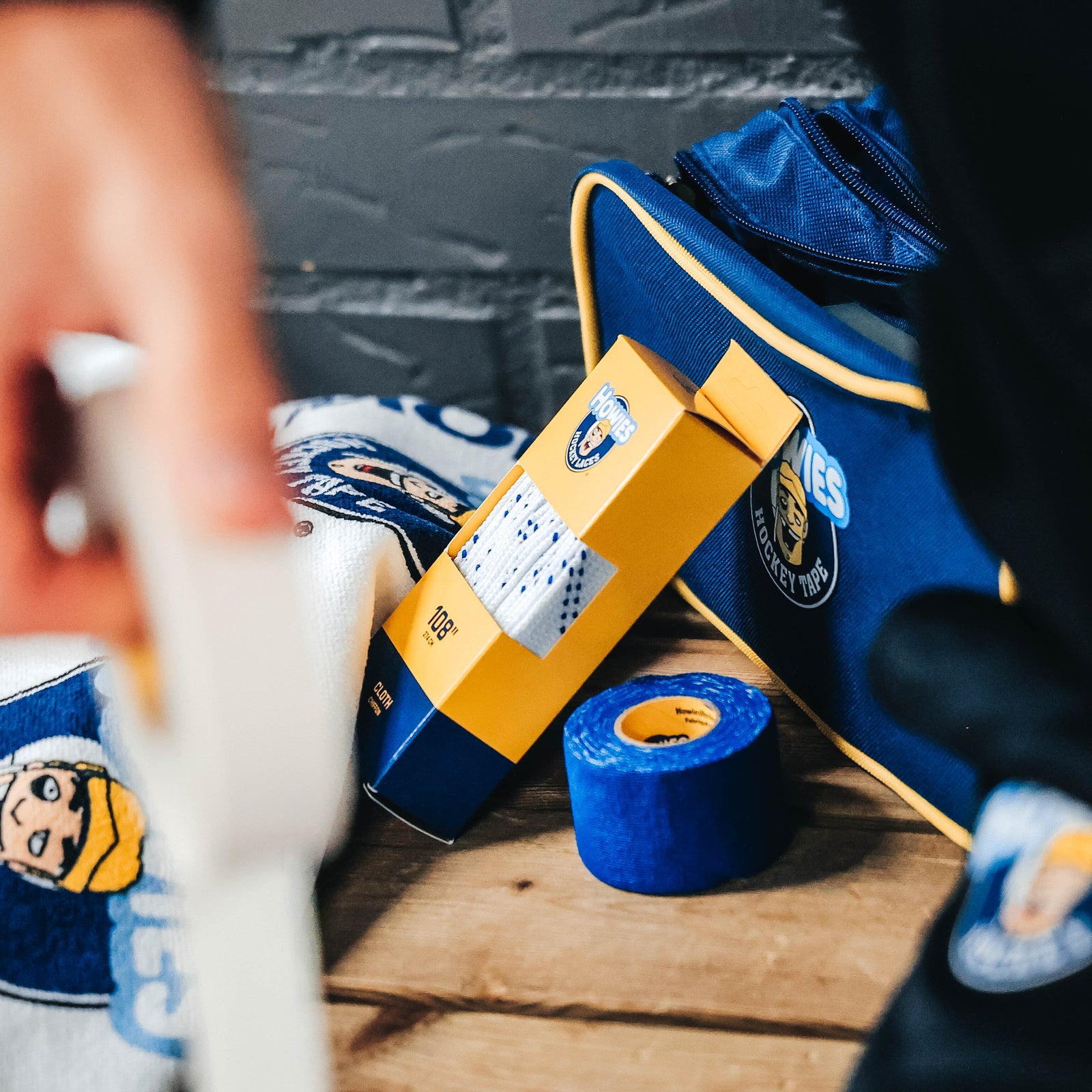 Locker room bench with Howies Hockey laces, Tape, accessory bag and bench towel