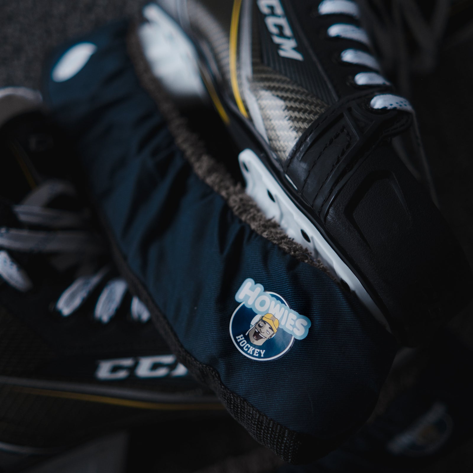 Pair of hockey skates with CCM branding on a dark background