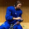 Woman wearing a blue hockey jersey 