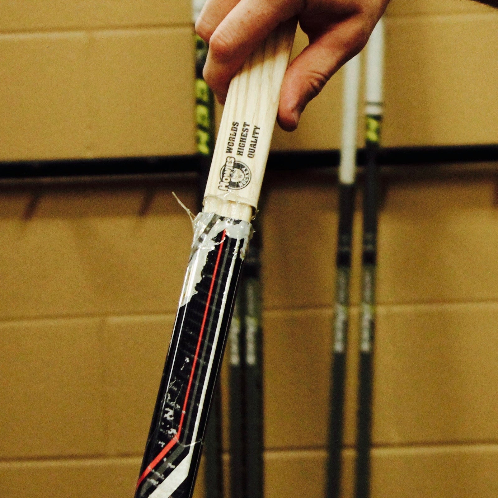 Howies Glue Stick being used to put an extension into a stick shaft 