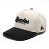 The Clean Sheet Lid by Howies Hockey Co. – cream and black snapback hat with raised black Howies script logo on the front