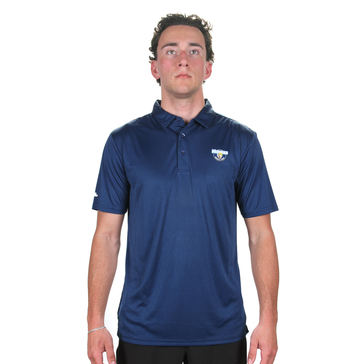 Man wearing nacy Polo with howies logo on breast 